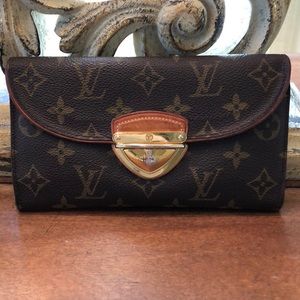 Louis Vuitton Wallet with push lock closure.